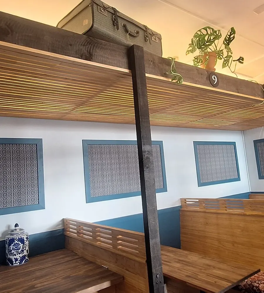 Built in window seats under a battened timber ceiling